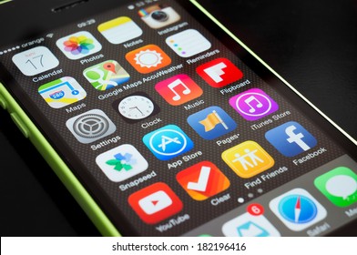 BUCHAREST, ROMANIA - MARCH 17, 2014: Photo of an iphone 5C home screen full of icons