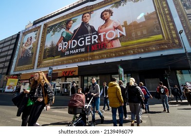 Bucharest, Romania - March 24, 2022: Extra large banner advertising Bridgerton TV Series is displayed on the Unirea Shopping Center, in downtown Bucharest.