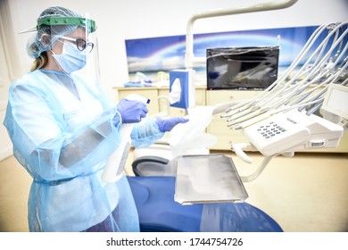 BUCHAREST, ROMANIA - MAY 14, 2020: Dentist sterilize the medical equipment inside a dental clinic during the corona virus pandemic  