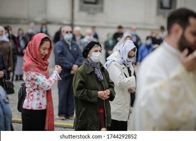 Bucharest, Romania - May 28, 2020: People Attend An Orthodox Church Service Outside The Patriarchal Palace With Social Distancing During The Covid-19 Outbreak.