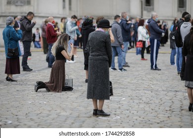 Bucharest, Romania - May 28, 2020: People Attend An Orthodox Church Service Outside The Patriarchal Palace With Social Distancing During The Covid-19 Outbreak.