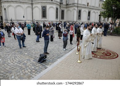 Bucharest, Romania - May 28, 2020: People Attend An Orthodox Church Service Outside The Patriarchal Palace With Social Distancing During The Covid-19 Outbreak.