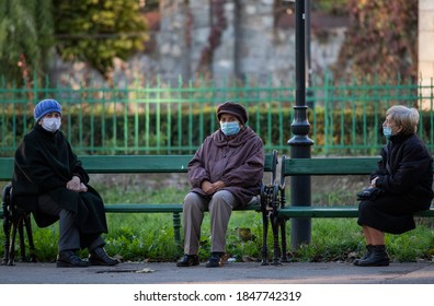 Bucharest, Romania - November 04, 2020: People on the street, wearing masks for protection against the COVID-19 infection, in Bucharest, Romania.