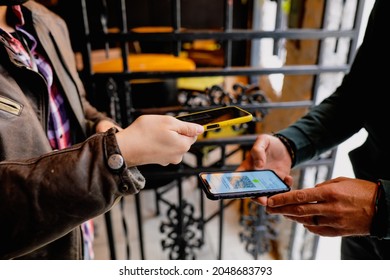 Bucharest, Romania - September 23, 2021: Shallow Depth Of Field (selective Focus) Image With A Restaurant Client Showing A Covid-19 Certificate From A Mobile Phone To An Employee.