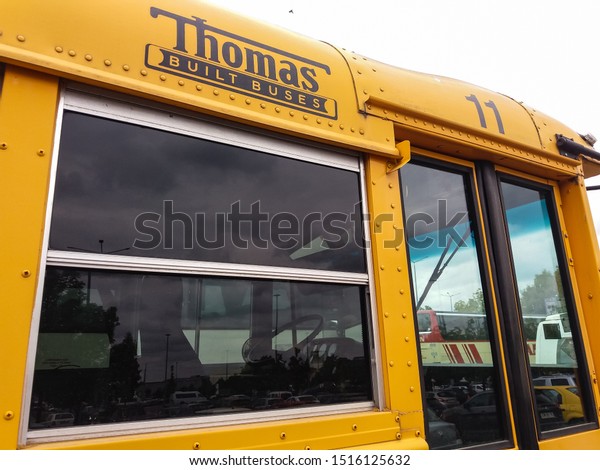 Bucharest, Romania - September 26, 2019: A\
classic American school bus from Thomas Built Buses on Freightliner\
FS-65 chassis is parked in\
Bucharest.