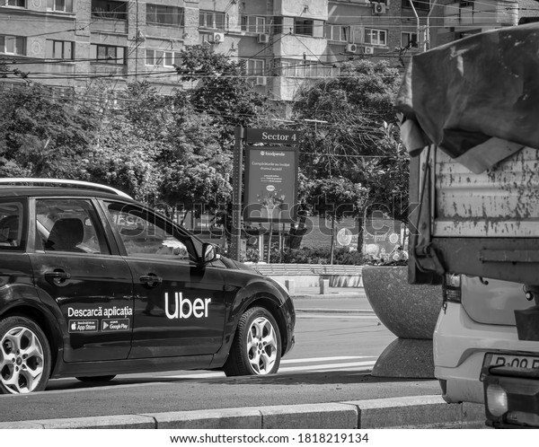 Bucharest/Romania - 08.28.2020:\
Car with the logo of the ride hailing company Uber at stoplight, in\
traffic.