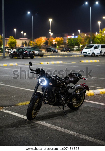 Bucharest/Romania\
- 12 November,2019 - The Cafe Racer from Ducati photographed in a\
parking lot in the night looks\
stuning