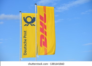 Buchholz, Lower Saxony / Germany - March 24, 2019: Flags With The Logo Of Deutsche Post An DHL In Buchholz, Germany - Deutsche Post DHL Is The World's Largest Logistics Company Headquartered In Bonn