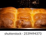 Buchteln (german also Rohrnudel), sweet rolls made from yeast dough that are filled with Powidl, fresh plums or jam, spread with butter and baked in the oven