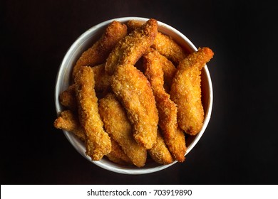 Bucket Of Chicken Nagets. On A Black Background, Top View.