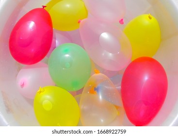 Bucket Full Of Water Balloons Holi Celebration. Balloon Background.