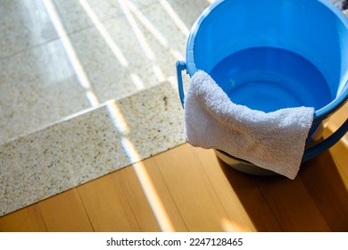 Bucket with rag and water for cleaning