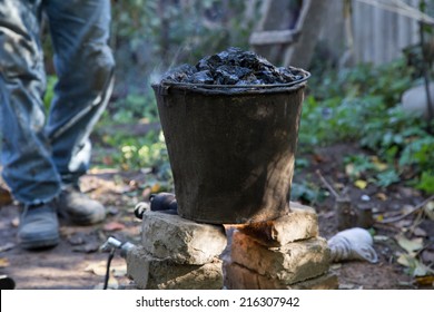 A Bucket Of Tar On The Fire, For Roof Repairs