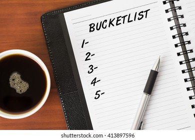 Bucketlist Word On A Notebook With A Pen And A Cup Of Coffee