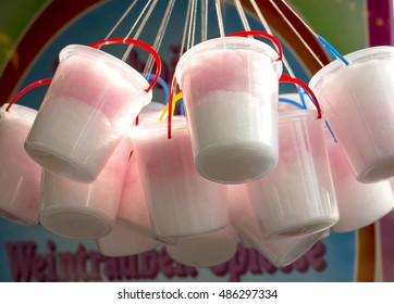 Buckets of Candy Floss. Candy floss, premade and sold in buckets, hang ready for a keen customer to buy