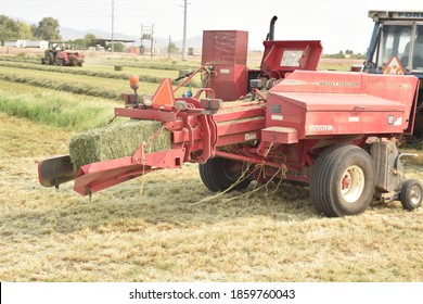 Buckeye, AZ. U.S.A. 9/8/2020. Ford 7710 Tractor Pulling A Hesston Alfalfa Baler.
