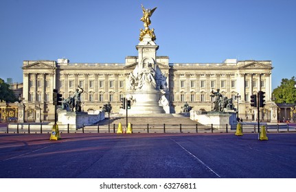 Buckingham Palace and Victoria Memorial in London, home to the Queen of England. Clear deep blue summer sky.