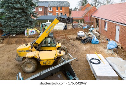 BUCKINGHAM, UK - December 02, 2016. Building work, construction site with heavy machinery on a heritage house renovation project, UK