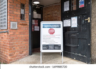 BUCKINGHAM, UK - March 30, 2020. Coronavirus COVID-19 Warning Sign With Prevention Information Outside A GP Doctor Surgery