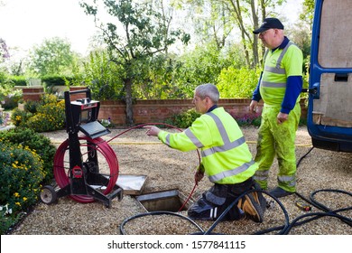 BUCKINGHAM, UK - October 16, 2019. A Drain Cleaning Company Checks A Blocked Drain With A Camera Prior To Jetting
