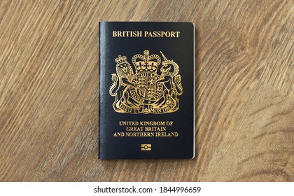 BUCKINGHAM, UK - October 25, 2020. New British passport. Flat lay of post-Brexit blue black UK passport cover.