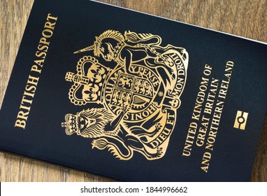 BUCKINGHAM, UK - October 25, 2020. New blue black British passport cover. Closeup of post-Brexit UK passport with biometric symbol