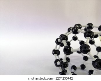 Buckminsterfullerence structure and white background. Buckminsterfullerene is a type of fullerene with the formula C60