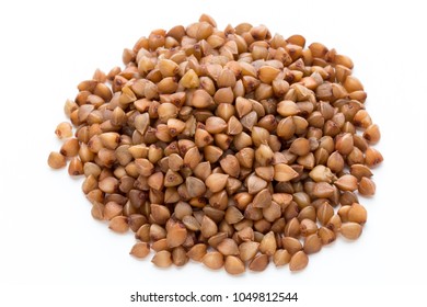Buckwheat cereal grains isolated on the white background.