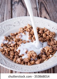 Buckwheat Cereal In White Plate Pour Milk