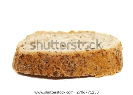 Buckwheat integral bread slice isolated on white background, side view
