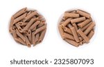 Buckwheat penne and tortiglioni, gluten free whole grain pasta, in white bowls. Brown noodles, made of pure buckwheat semolina, extruded into cylinder-shaped pieces, with ridges to take on more sauce.