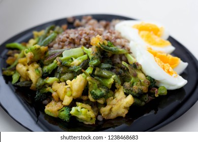 Buckwheat porridge with boiled eggs, vegetables and broccoli