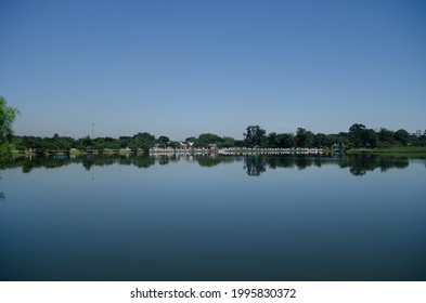 Bucolic lake with reflected trees - Shutterstock ID 1995830372
