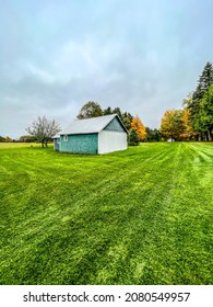 Bucolic Northern Michigan Centennial Farm Scene with Green Barn - Shutterstock ID 2080549957