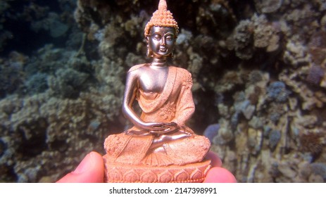 Buda Statue On The Red Sea Sand Bottom