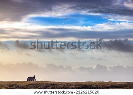 Budakirkja black Church, Snaefellsnes Peninsula, Iceland. Sunrise shot of this tradition wooden church in autumn. This 19th century chruch sits in a volcanic lava field. 