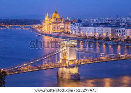 Budapest city night scene. View at  Chain bridge, river Danube and famous building of Parliament. Budapest city is capital of east european country Hungary.