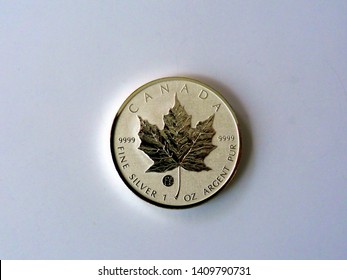 Budapest, Hungary - 05.23.2019: Silver Maple. Canadian fine silver one ounce coin. 0.9999 pure silver with the emblematic shiny maple leaf relief. valuable to coin collectors. Maple leaf silver coin.