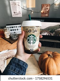 Budapest. / Hungary  - 07.10.2018. Watching Films And Drinkin Starbucks Latte. Halloween And Autumn Mood. Pumpkin. Autumn Atmosphere.