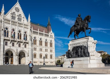 BUDAPEST, HUNGARY - 12 OCTOBER, 2019: The bronze equestrian statue of Count Gyula Andrassy in front of the building of Parliament in Budapest, Hungary