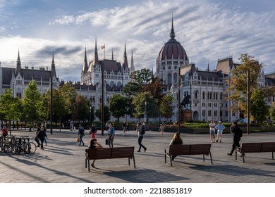 Budapest, Hungary - 1st September 2022: People Walking On The Street With The Hungarian Parliament Building In Background