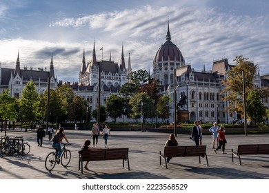 Budapest, Hungary - 1st September 2022: People Walking On The Street With The Hungarian Parliament Building In Background