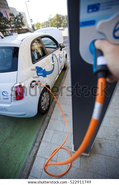 BUDAPEST,\
HUNGARY 22 September, 2010: An electric car is parking at a\
charging station in a Budapest downtown\
street.