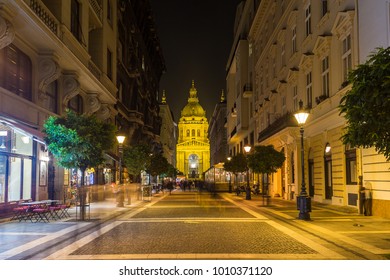 BUDAPEST, HUNGARY - 29TH OCTOBER 2015: A View Down Zrinyi Street In Budapest At Night With St Stephen's Basilica In The Distance.