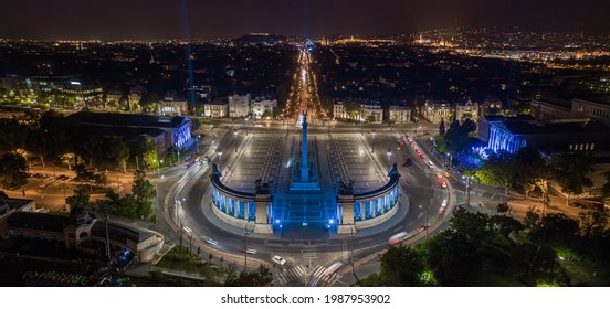 Budapest, Hungary - Aerial panoramic view of Heroes' Square by night lit with unique blue lights. Andrassy street at background