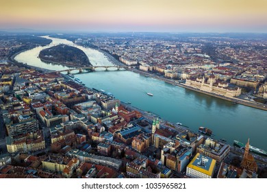 Budapest, Hungary - Aerial skyline view of Budapest with Parliament of Hungary, Margaret Island and Bridge and sightseeing boat on River Danube at sunset