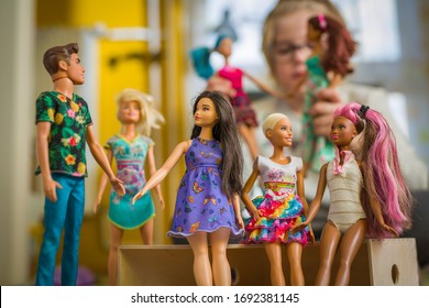 Budapest, Hungary / April 1, 2019 - Young Girl Playing With Her Barbie Toy Dolls Of Diverse Variety. Educating Diversity Concept. Illustrative Editorial.