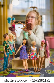 Budapest, Hungary / April 1, 2019 - Young Girl Playing With Her Barbie Toy Dolls Of Diverse Variety. Educating Diversity Concept. Illustrative Editorial.