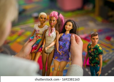 Budapest, Hungary / April 1, 2019 - Young Girl Playing With Her Barbie Toy Dolls Of Diverse Variety. Educating Diversity Concept. Illustrative Editorial.