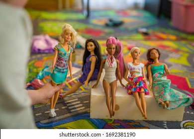 Budapest, Hungary / April 1, 2019 - Young Girl Playing With Her Barbie Toy Dolls Of Diverse Variety. Educating Diversity Concept. Illustrative Editorial.